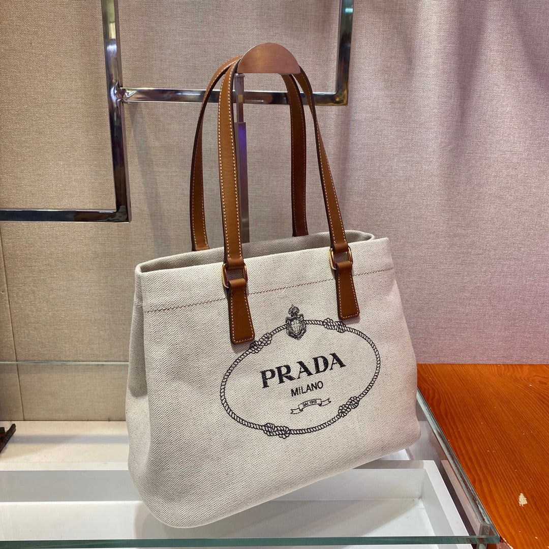 PRADA TOTE BAG 33 IN WHITE CANVAS AND BROWN CALFSKIN HANDLE