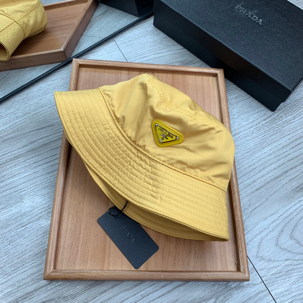 PRADA BUCKET HAT IN GOLDEN YELLOW RE-NYLON 234109