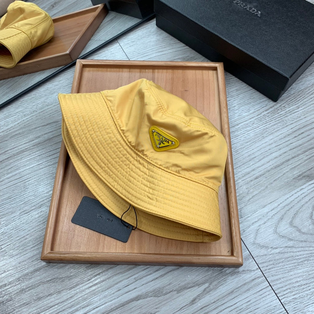 PRADA BUCKET HAT IN GOLDEN YELLOW RE-NYLON 234109