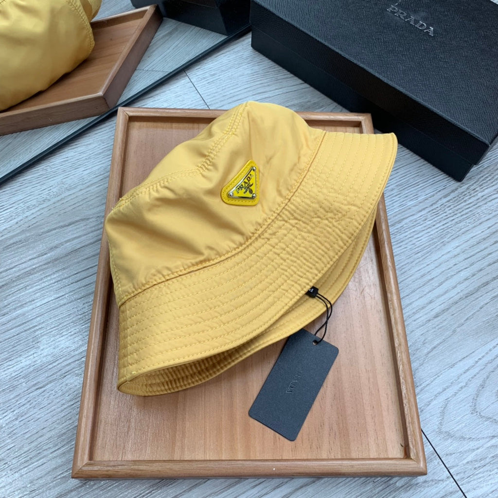 PRADA BUCKET HAT IN GOLDEN YELLOW RE-NYLON 234109