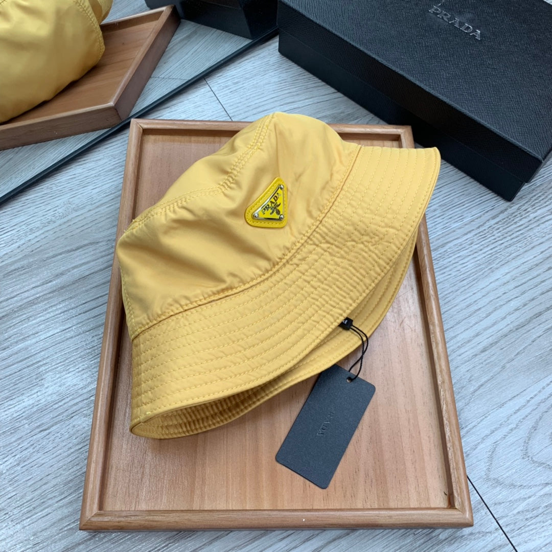 PRADA BUCKET HAT IN GOLDEN YELLOW RE-NYLON 234109