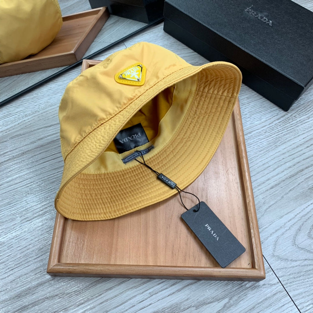 PRADA BUCKET HAT IN GOLDEN YELLOW RE-NYLON 234109