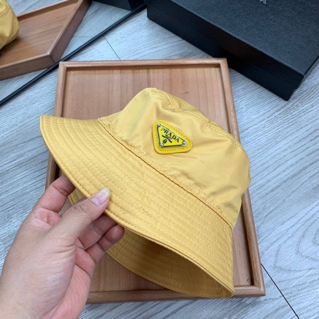 PRADA BUCKET HAT IN GOLDEN YELLOW RE-NYLON 234109