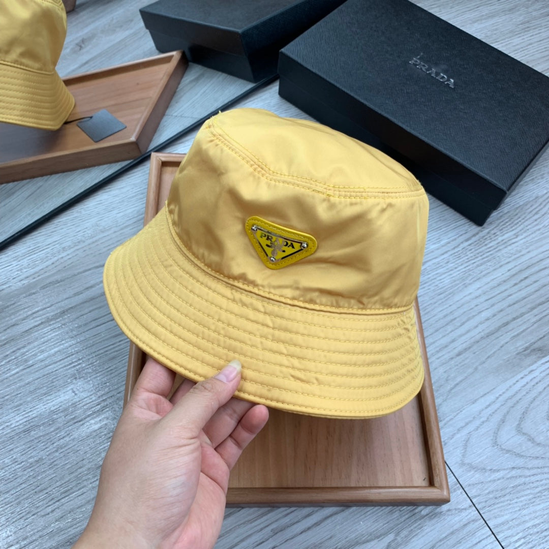 PRADA BUCKET HAT IN GOLDEN YELLOW RE-NYLON 234109