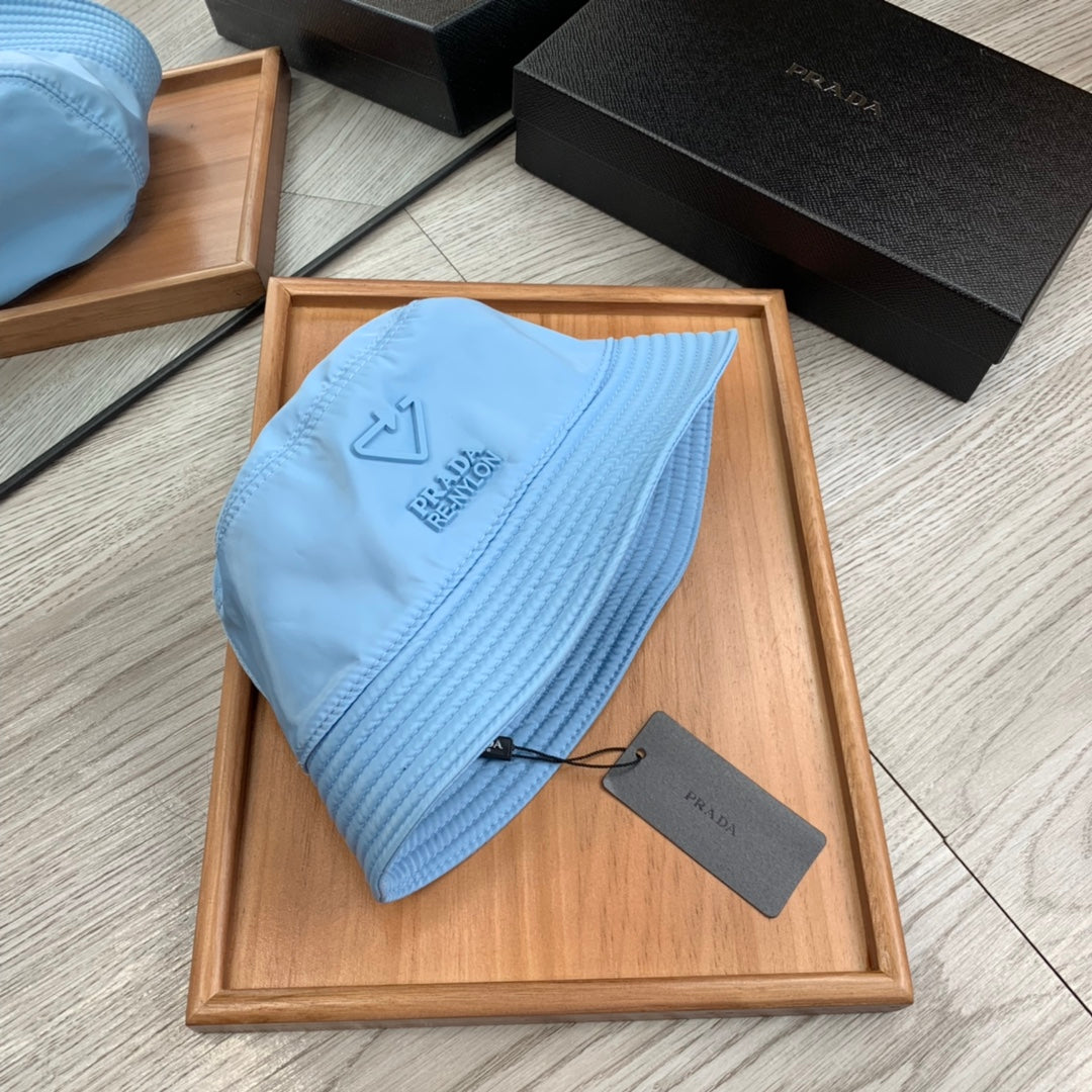 PRADA BUCKET HAT IN CERULEAN BLUE RE-NYLON 234101