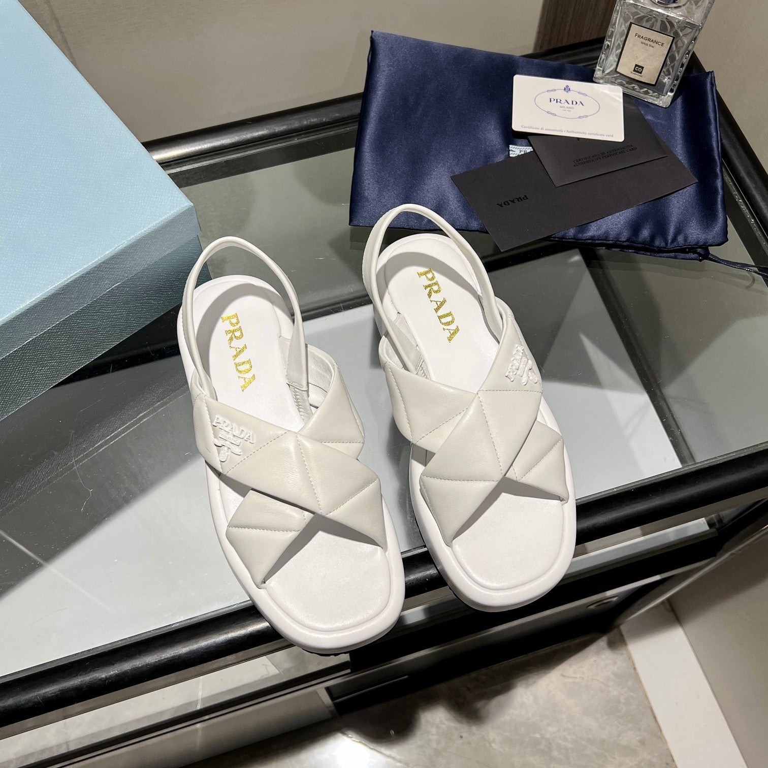 PRADA PADDED CRISSCROSS SANLS WHITE LAMBSKIN