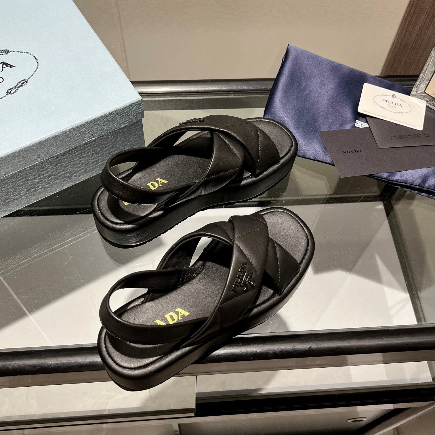 PRADA PADDED CRISSCROSS SANLS BLACK LAMBSKIN