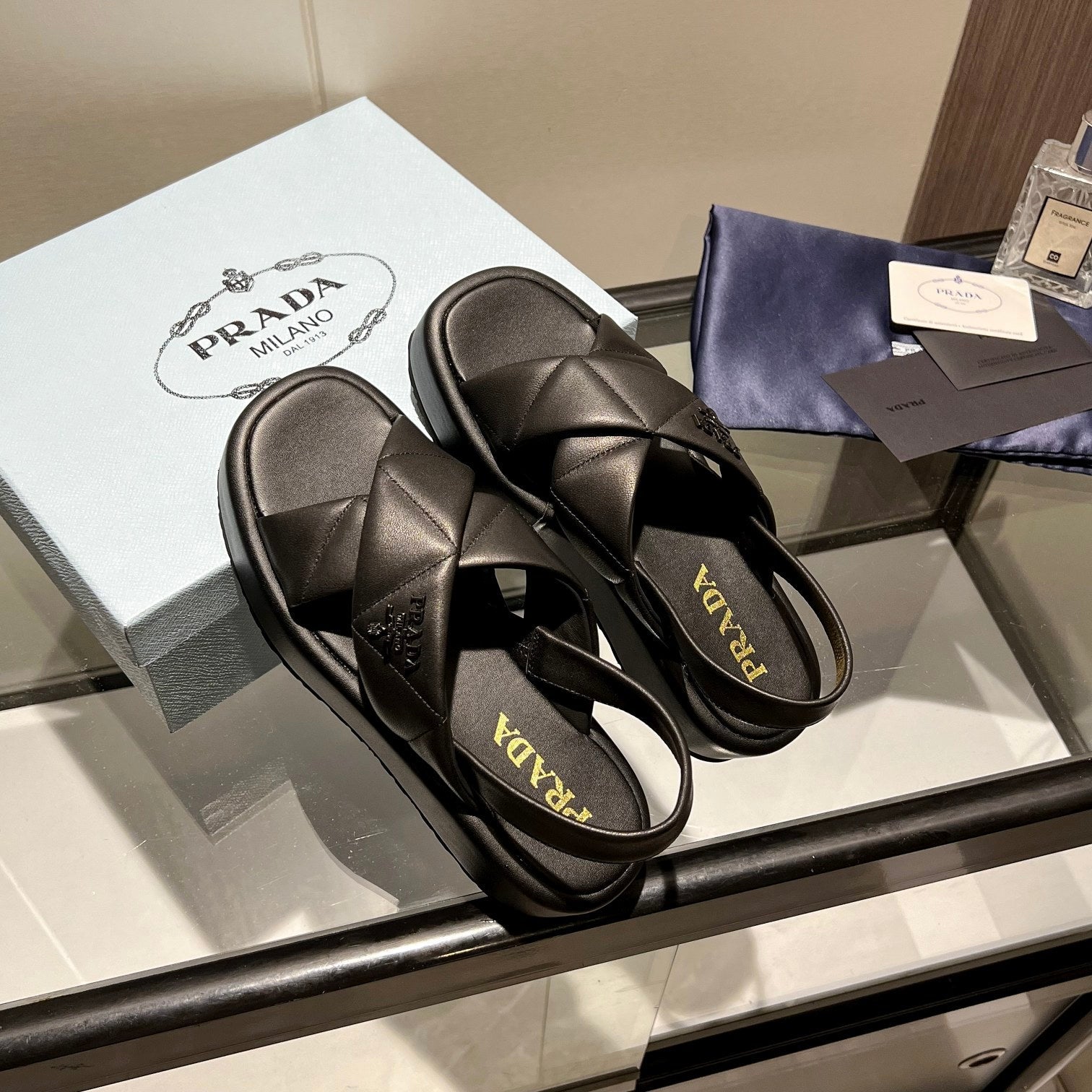 PRADA PADDED CRISSCROSS SANLS BLACK LAMBSKIN