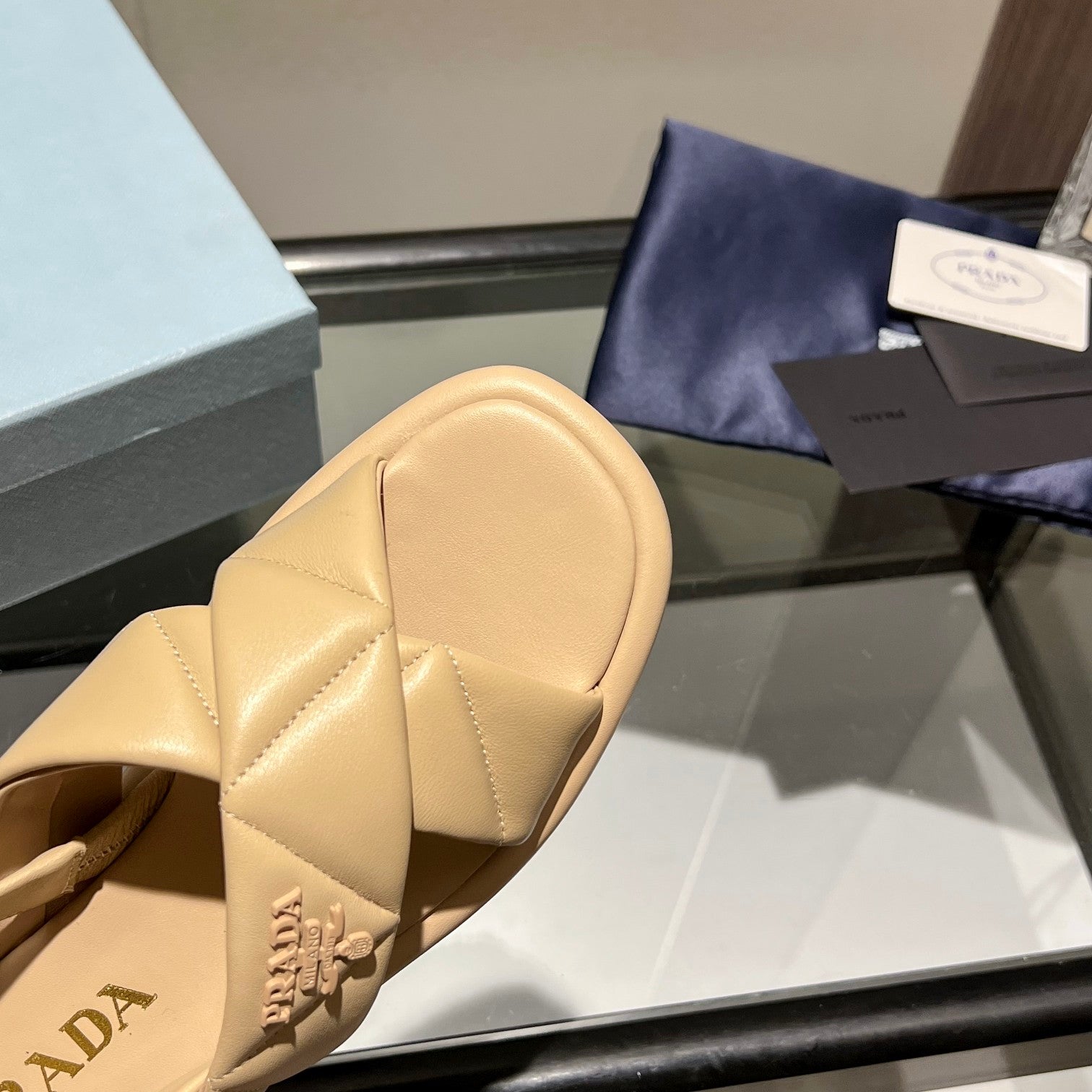 PRADA PADDED CRISSCROSS SANLS BEIGE LAMBSKIN