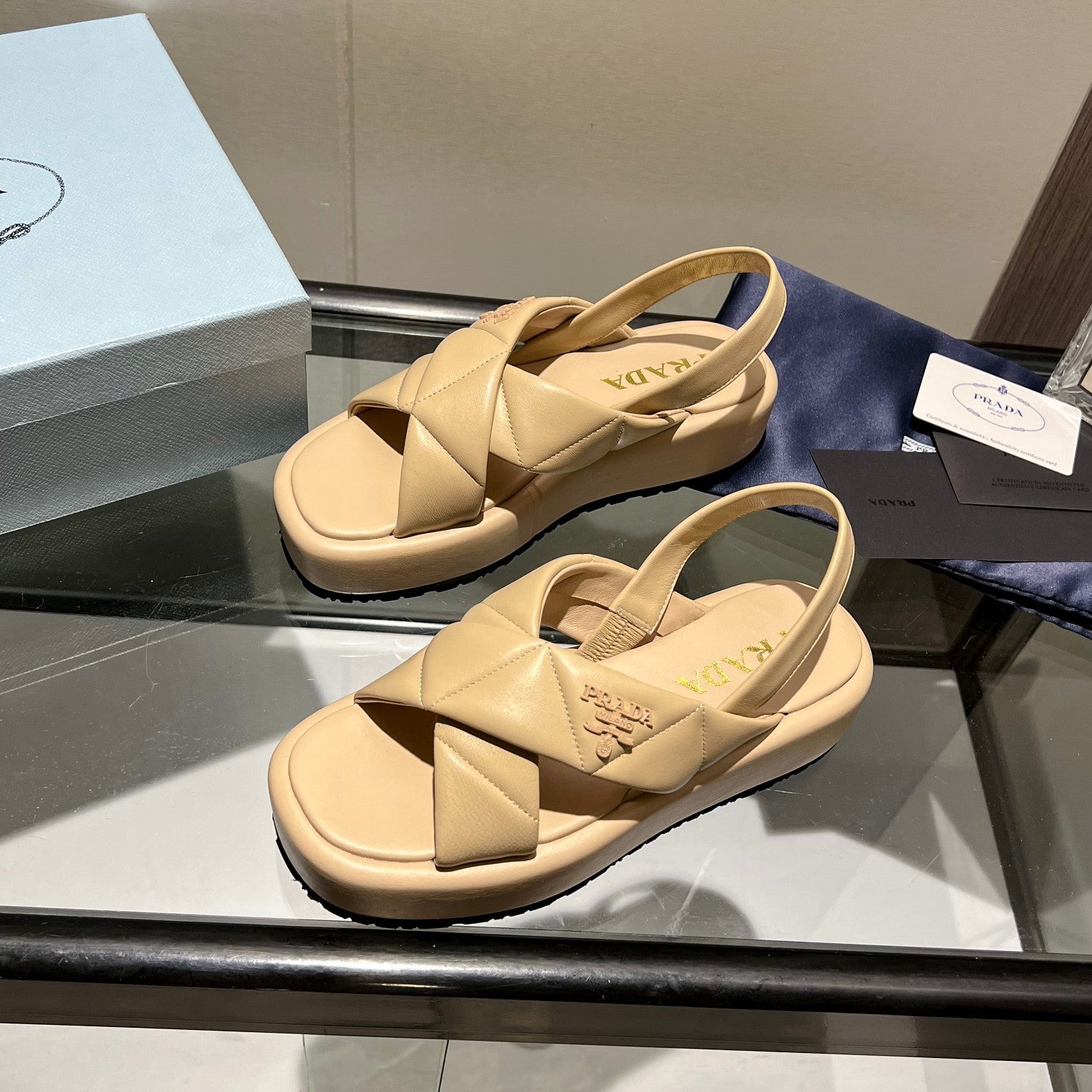 PRADA PADDED CRISSCROSS SANLS BEIGE LAMBSKIN