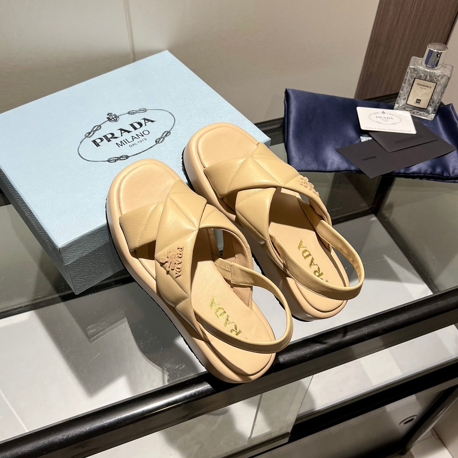 PRADA PADDED CRISSCROSS SANLS BEIGE LAMBSKIN