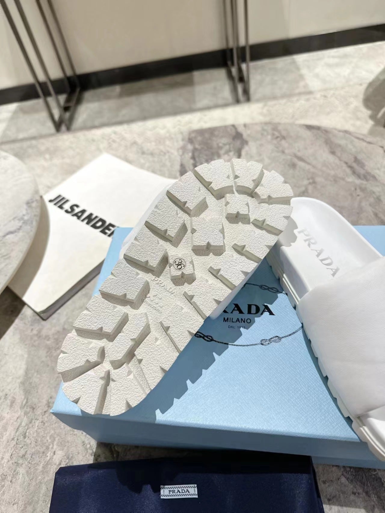 PRADA SHEARLING SLIDES WHITE LAMBSKIN