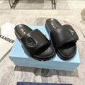 PRADA SHEARLING SLIDES BLACK LAMBSKIN