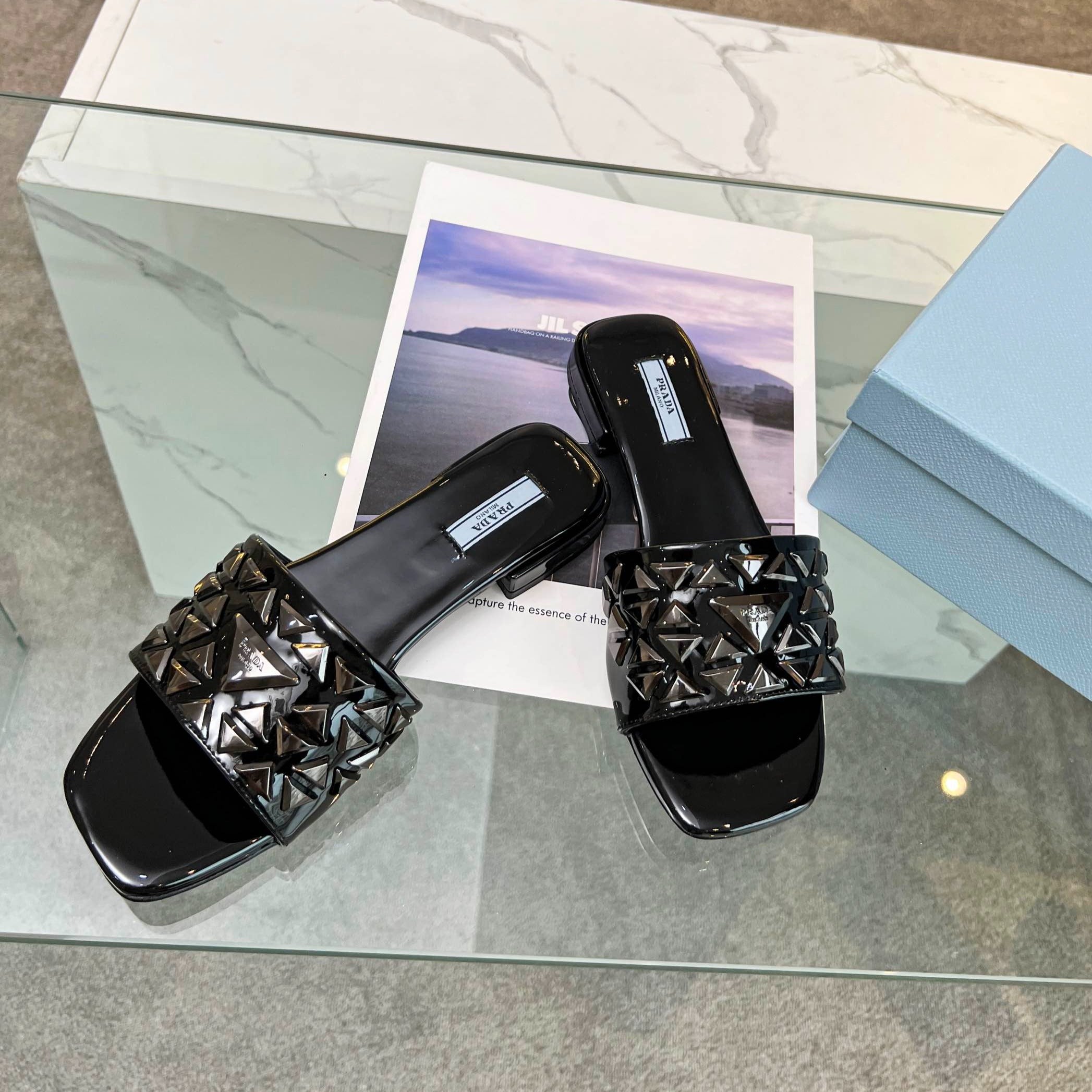 PRADA EMBROIDERED SLIDES FLAT BLACK CALFSKIN