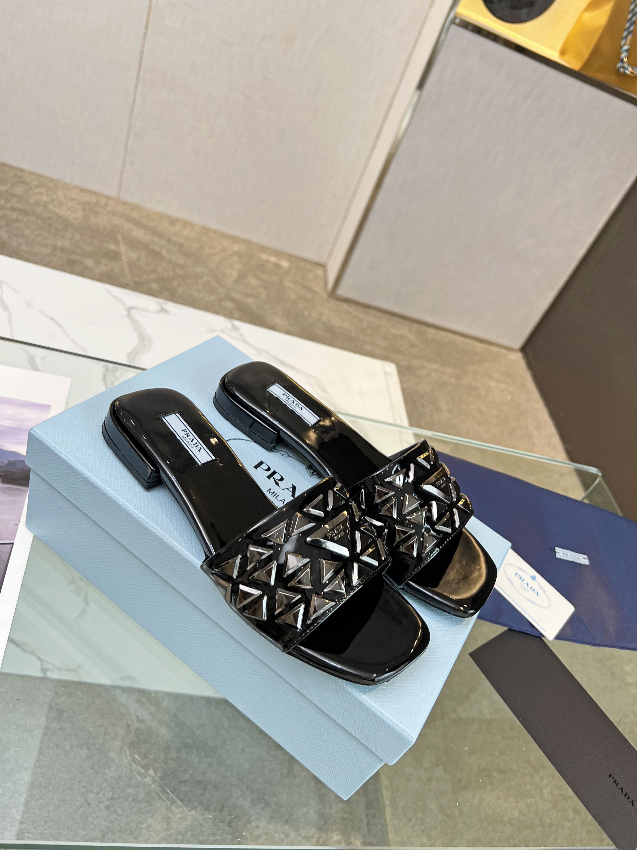 PRADA EMBROIDERED SLIDES FLAT BLACK CALFSKIN