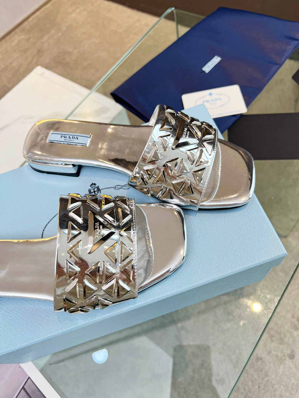 PRADA EMBROIDERED SLIDES FLAT SILVER CALFSKIN