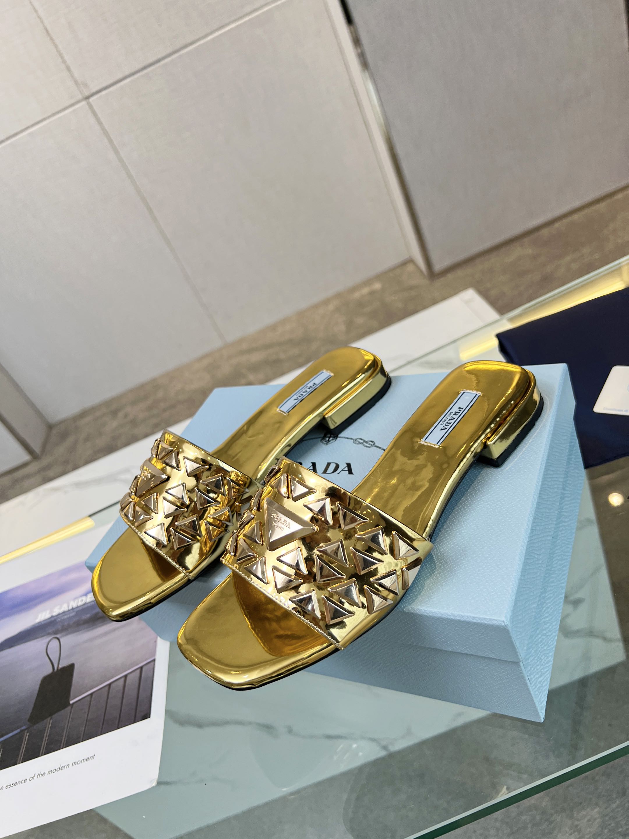 PRADA EMBROIDERED SLIDES FLAT METALLIC GOLD CALFSKIN