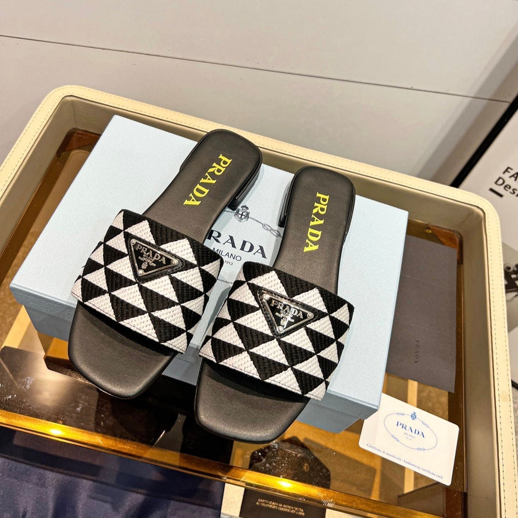 PRADA EMBROIDERED SLIDES FLAT BLACK AND WHITE FABRIC
