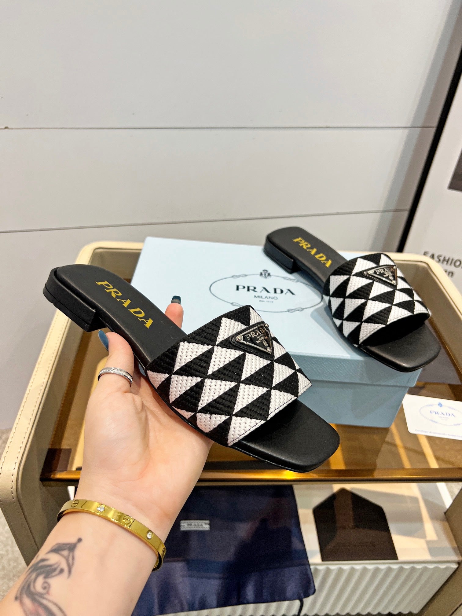 PRADA EMBROIDERED SLIDES FLAT BLACK AND WHITE FABRIC