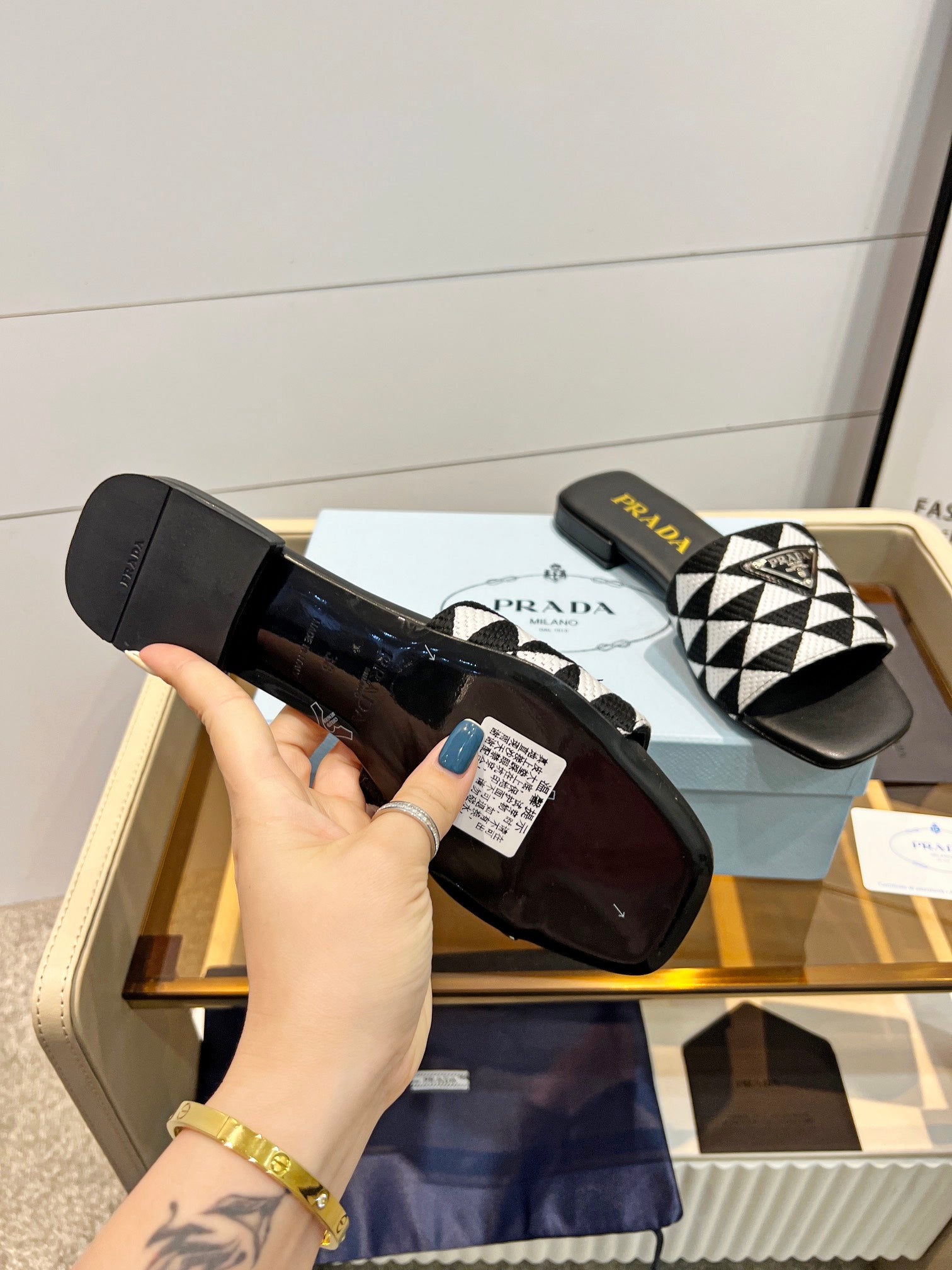 PRADA EMBROIDERED SLIDES FLAT BLACK AND WHITE FABRIC