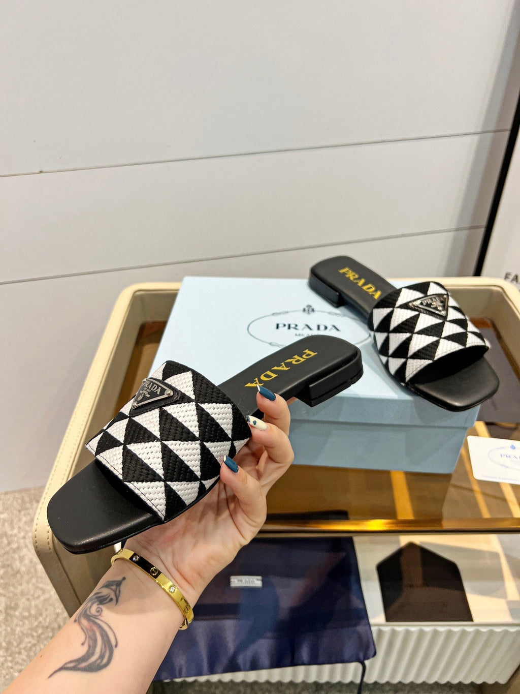 PRADA EMBROIDERED SLIDES FLAT BLACK AND WHITE FABRIC