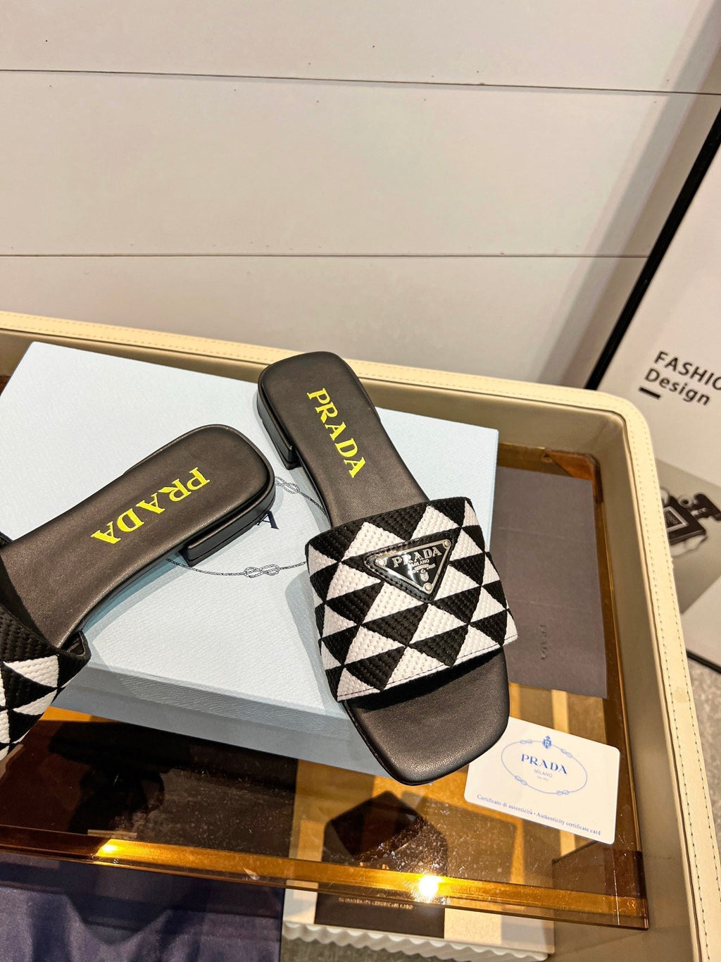 PRADA EMBROIDERED SLIDES FLAT BLACK AND WHITE FABRIC