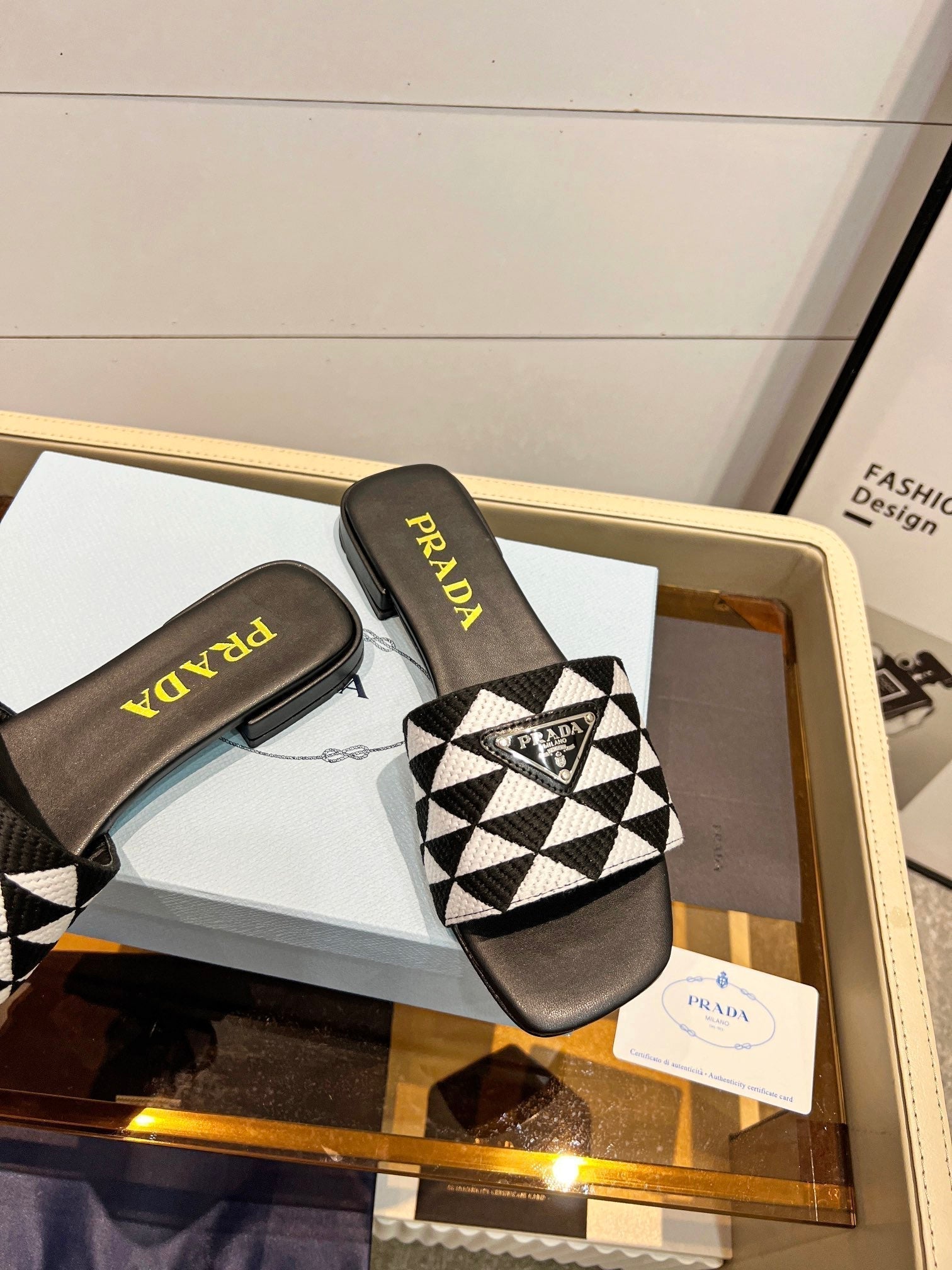 PRADA EMBROIDERED SLIDES FLAT BLACK AND WHITE FABRIC