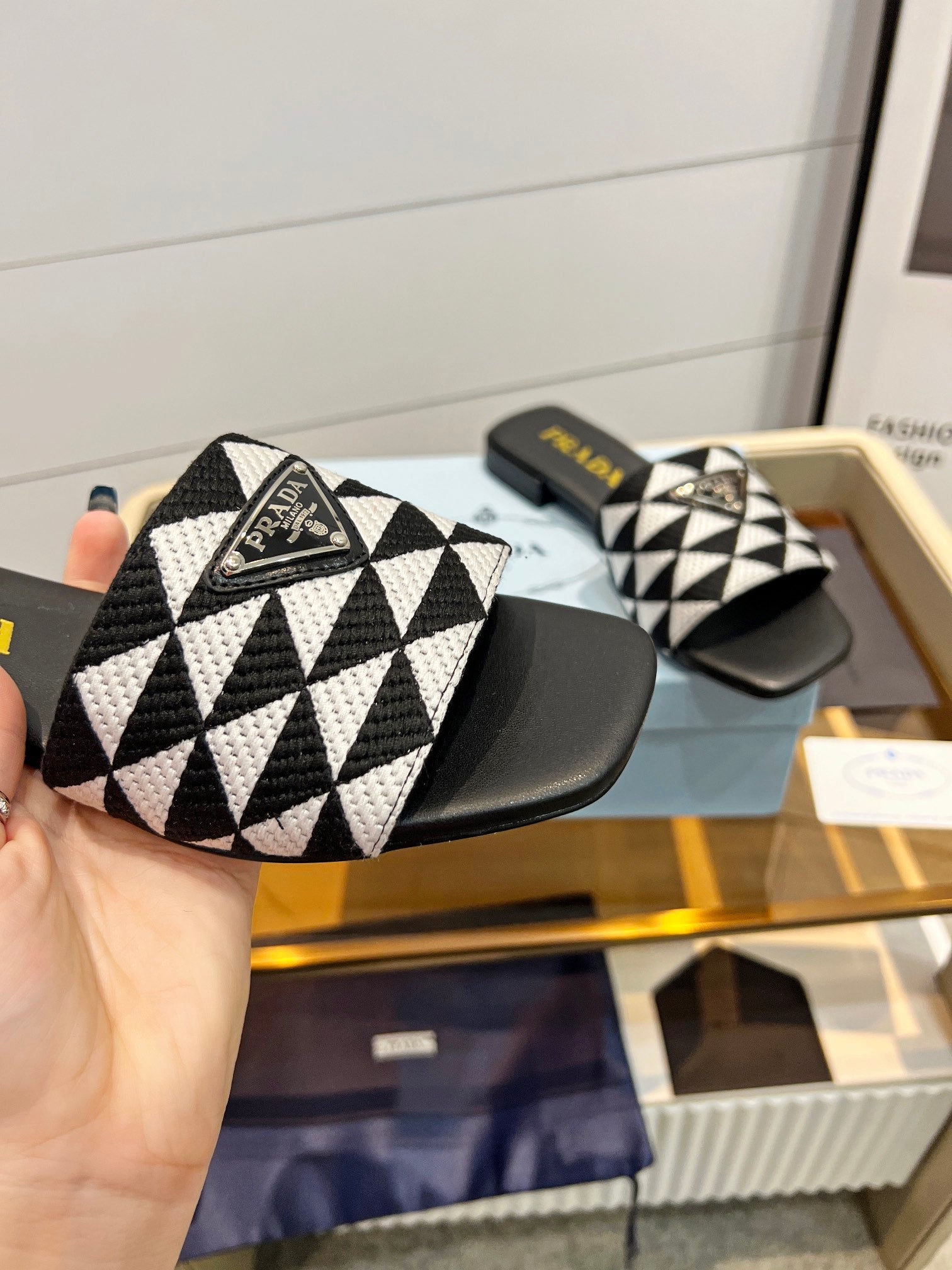PRADA EMBROIDERED SLIDES FLAT BLACK AND WHITE FABRIC