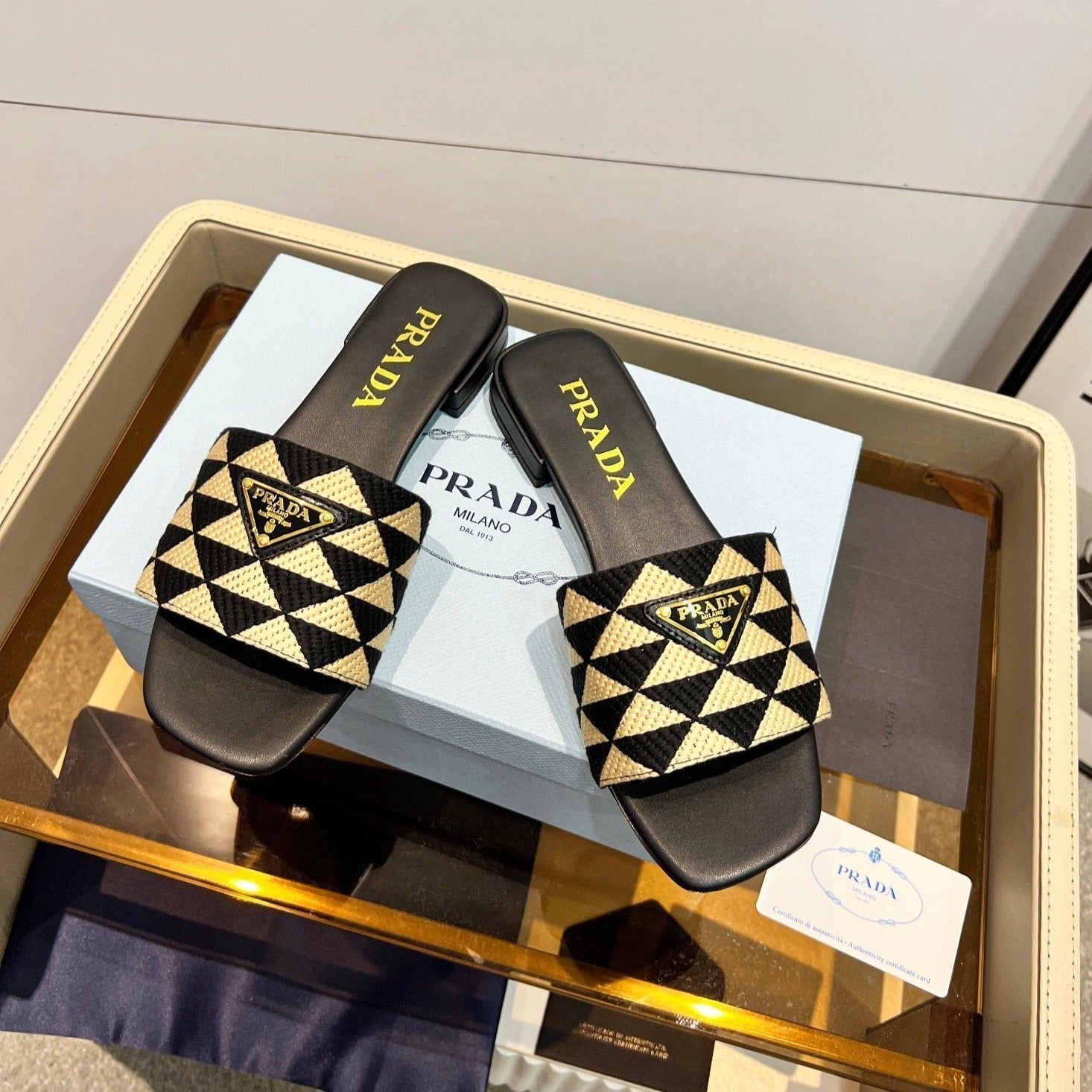PRADA EMBROIDERED SLIDES FLAT BLACK AND BEIGE FABRIC