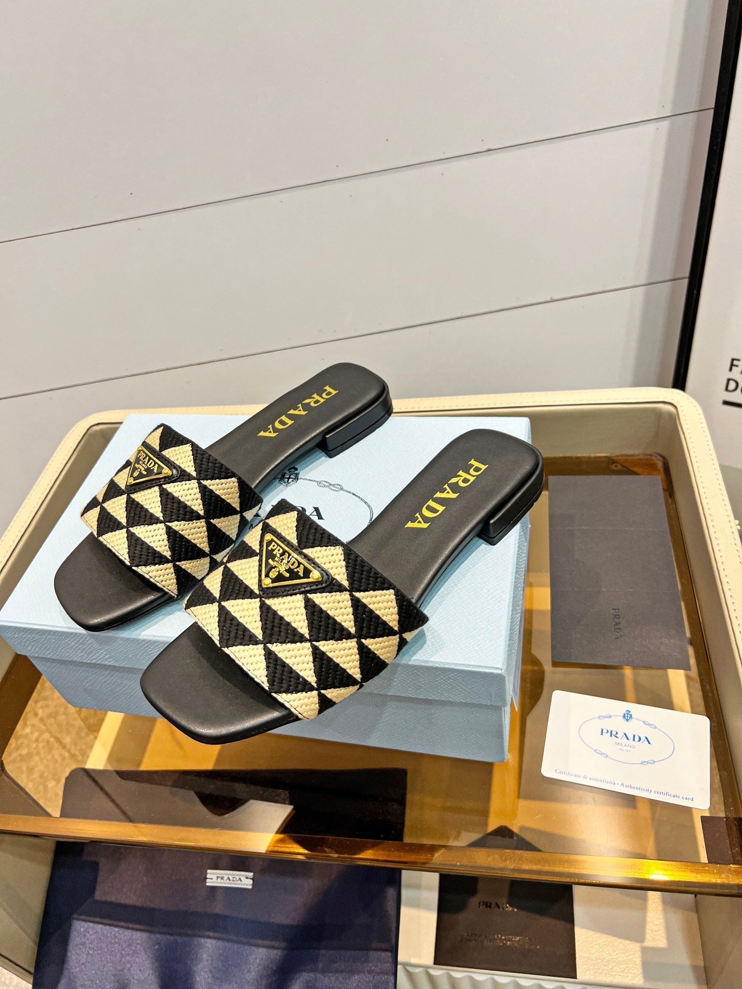 PRADA EMBROIDERED SLIDES FLAT BLACK AND BEIGE FABRIC