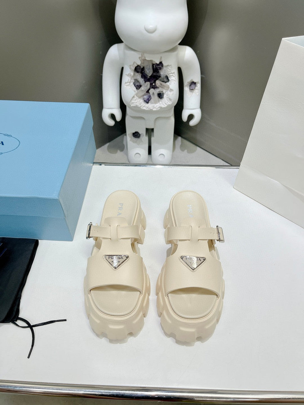 PRADA MONOLITH SLIPPER SANLS IN BEIGE RUBBER