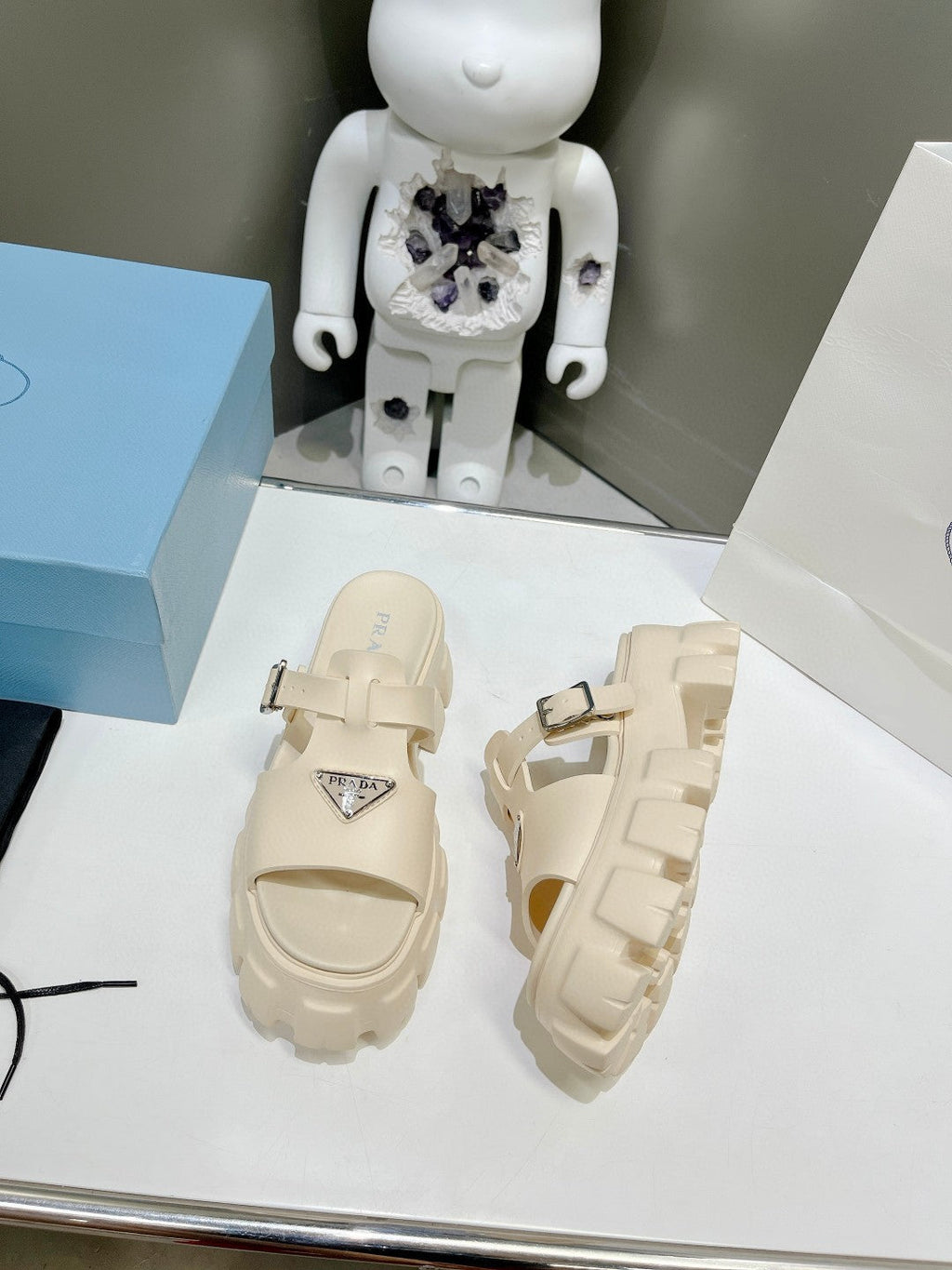 PRADA MONOLITH SLIPPER SANLS IN BEIGE RUBBER