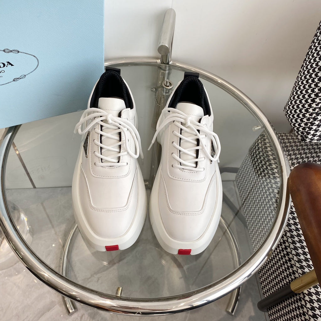 PRADA THICK-SOLE SNEAKERS IN CALFSKIN