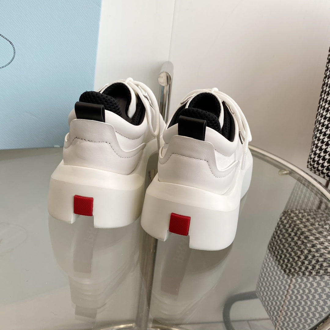 PRADA THICK-SOLE SNEAKERS IN CALFSKIN
