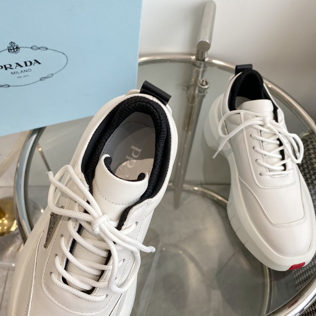 PRADA THICK-SOLE SNEAKERS IN CALFSKIN