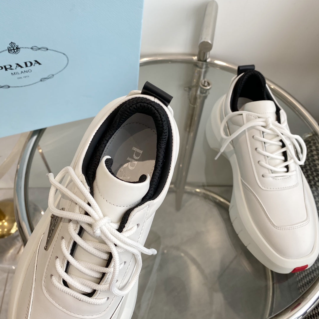 PRADA THICK-SOLE SNEAKERS IN CALFSKIN