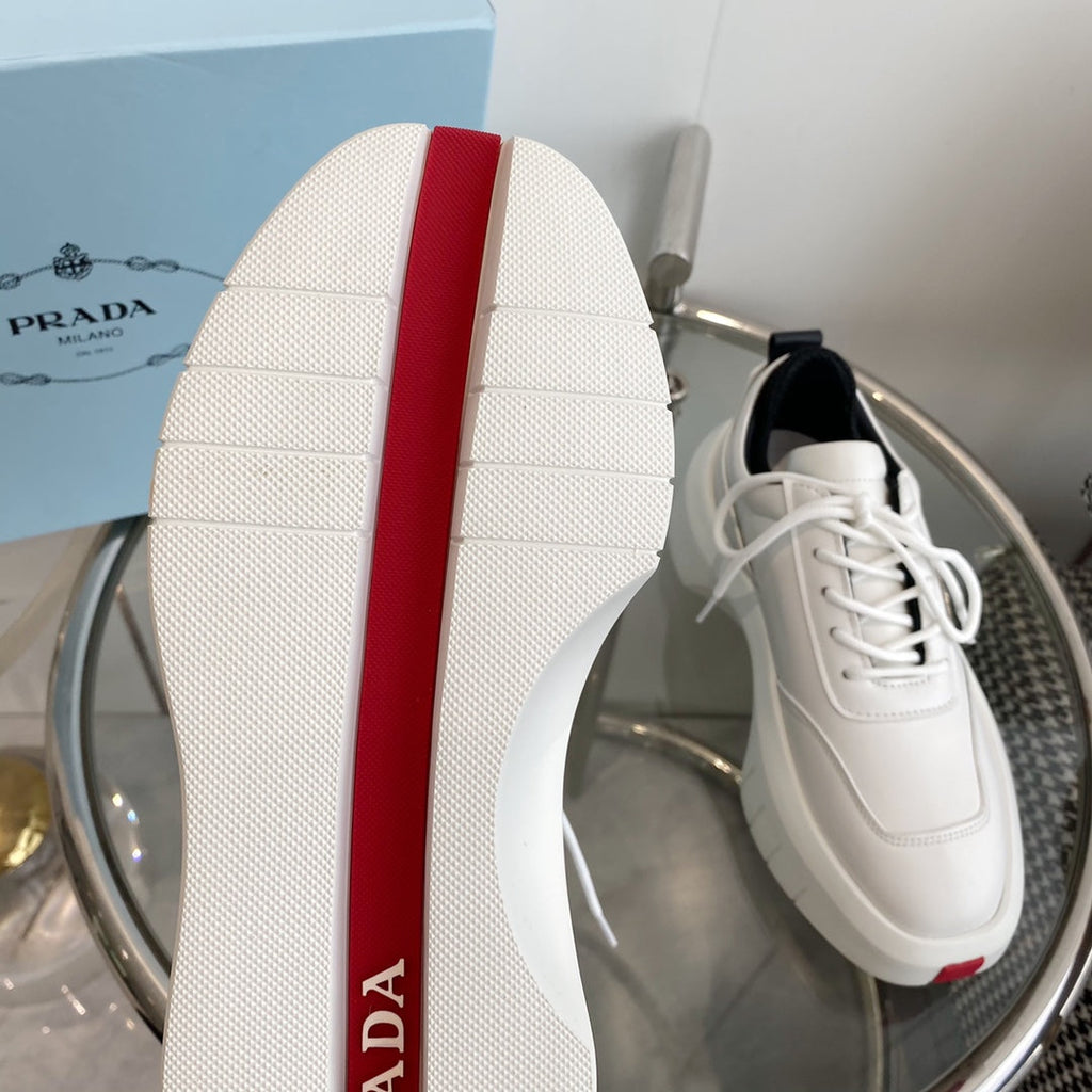PRADA THICK-SOLE SNEAKERS IN CALFSKIN