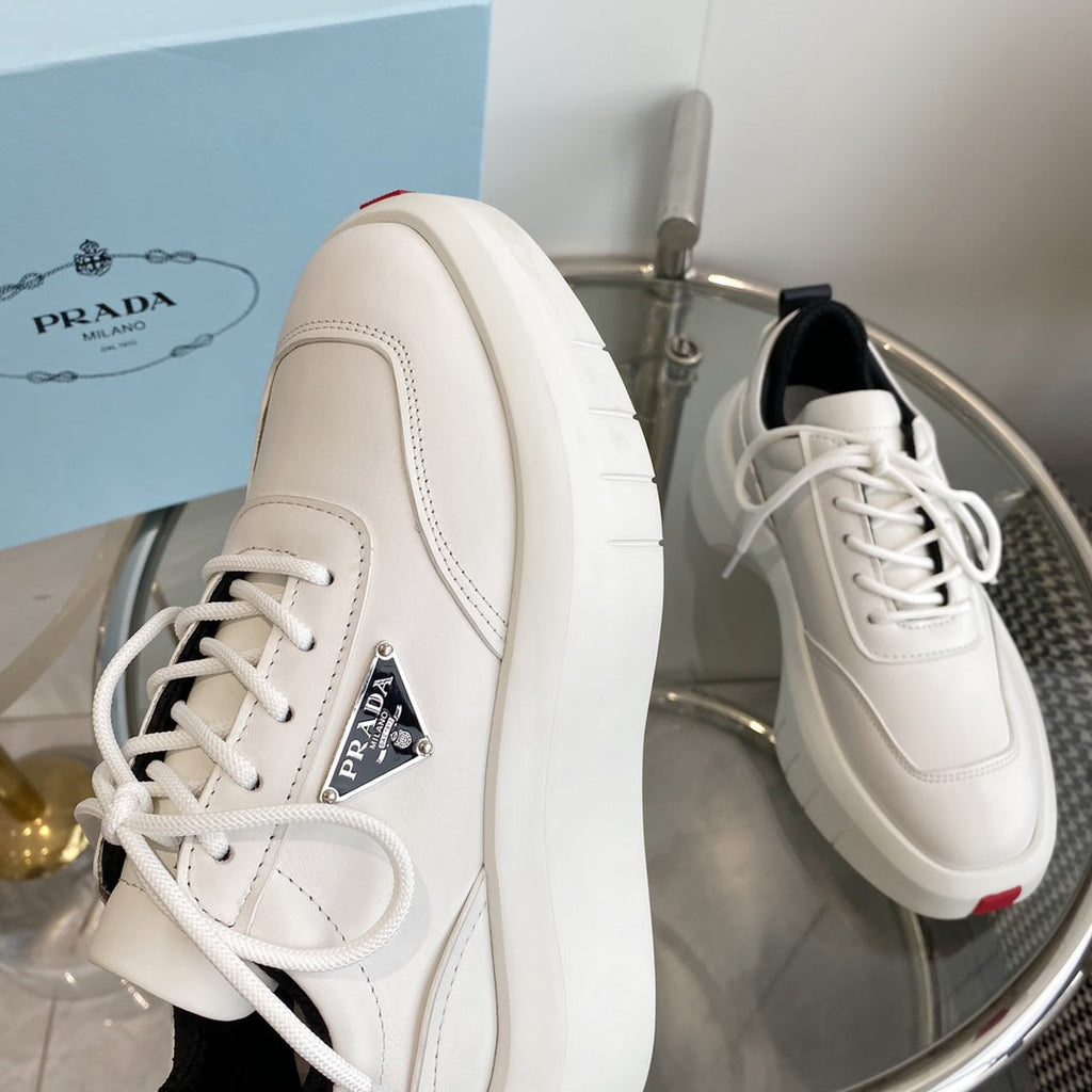 PRADA THICK-SOLE SNEAKERS IN CALFSKIN