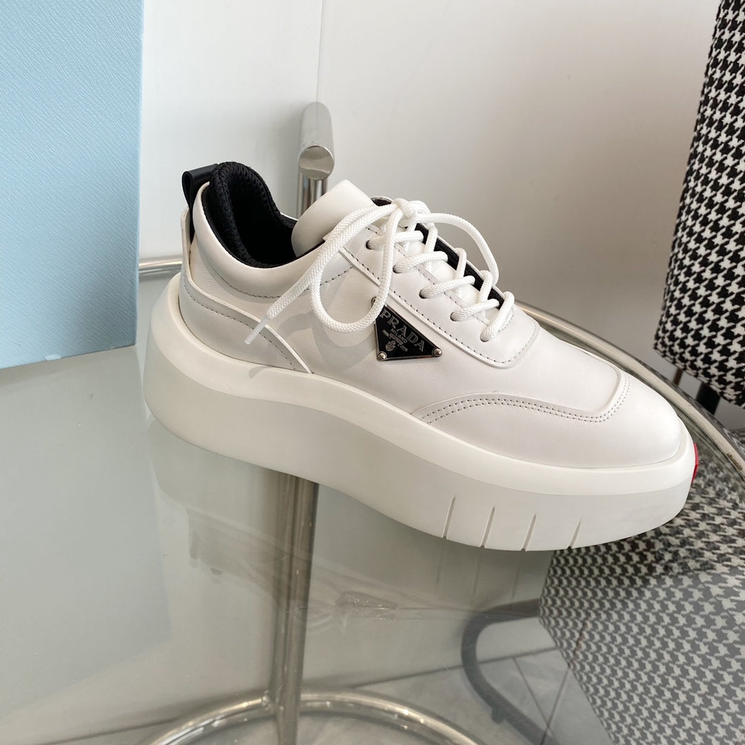 PRADA THICK-SOLE SNEAKERS IN CALFSKIN