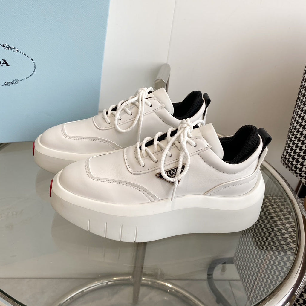 PRADA THICK-SOLE SNEAKERS IN CALFSKIN