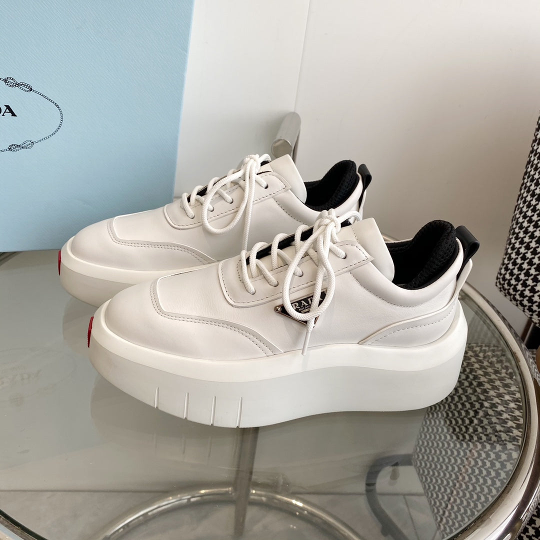 PRADA THICK-SOLE SNEAKERS IN CALFSKIN