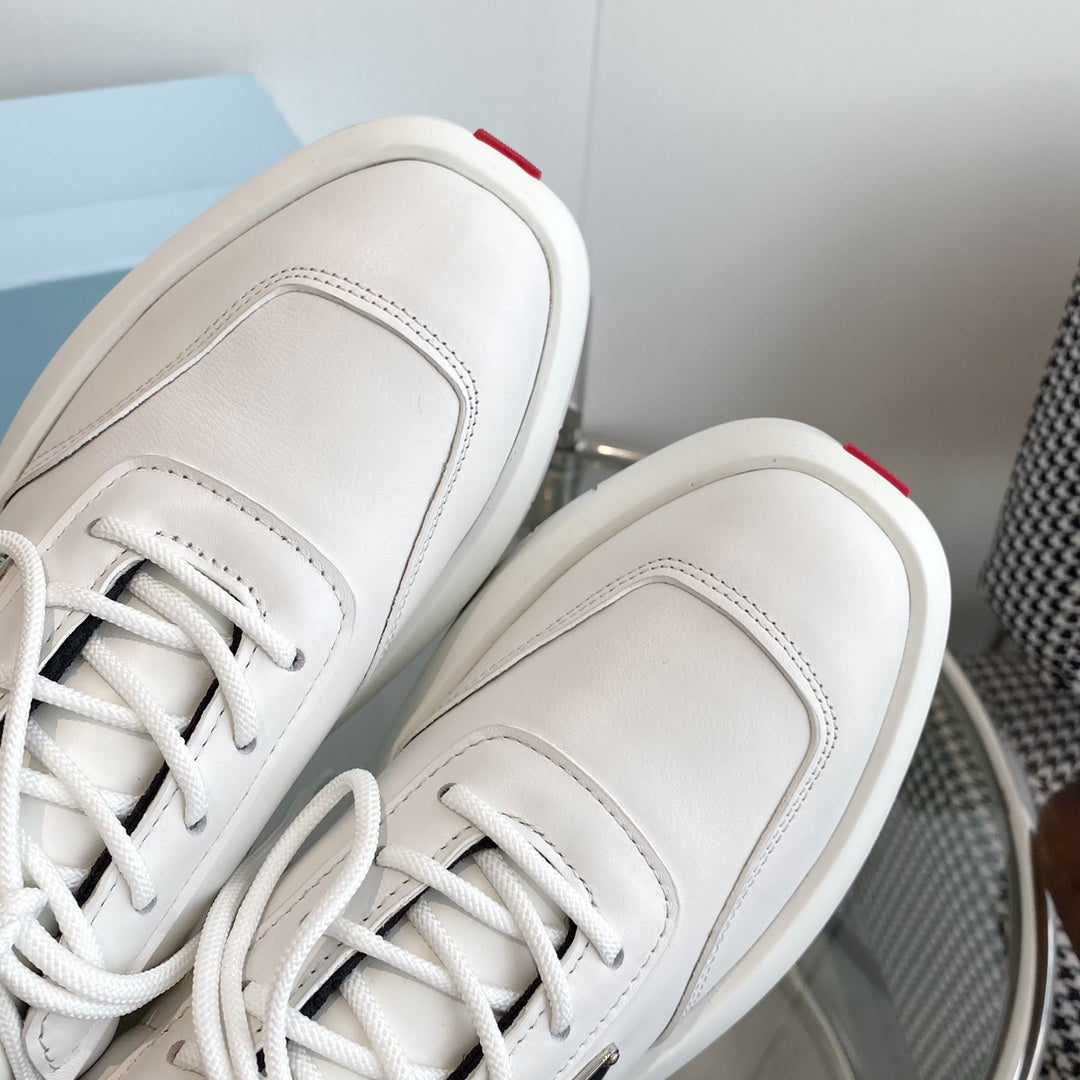 PRADA THICK-SOLE SNEAKERS IN CALFSKIN