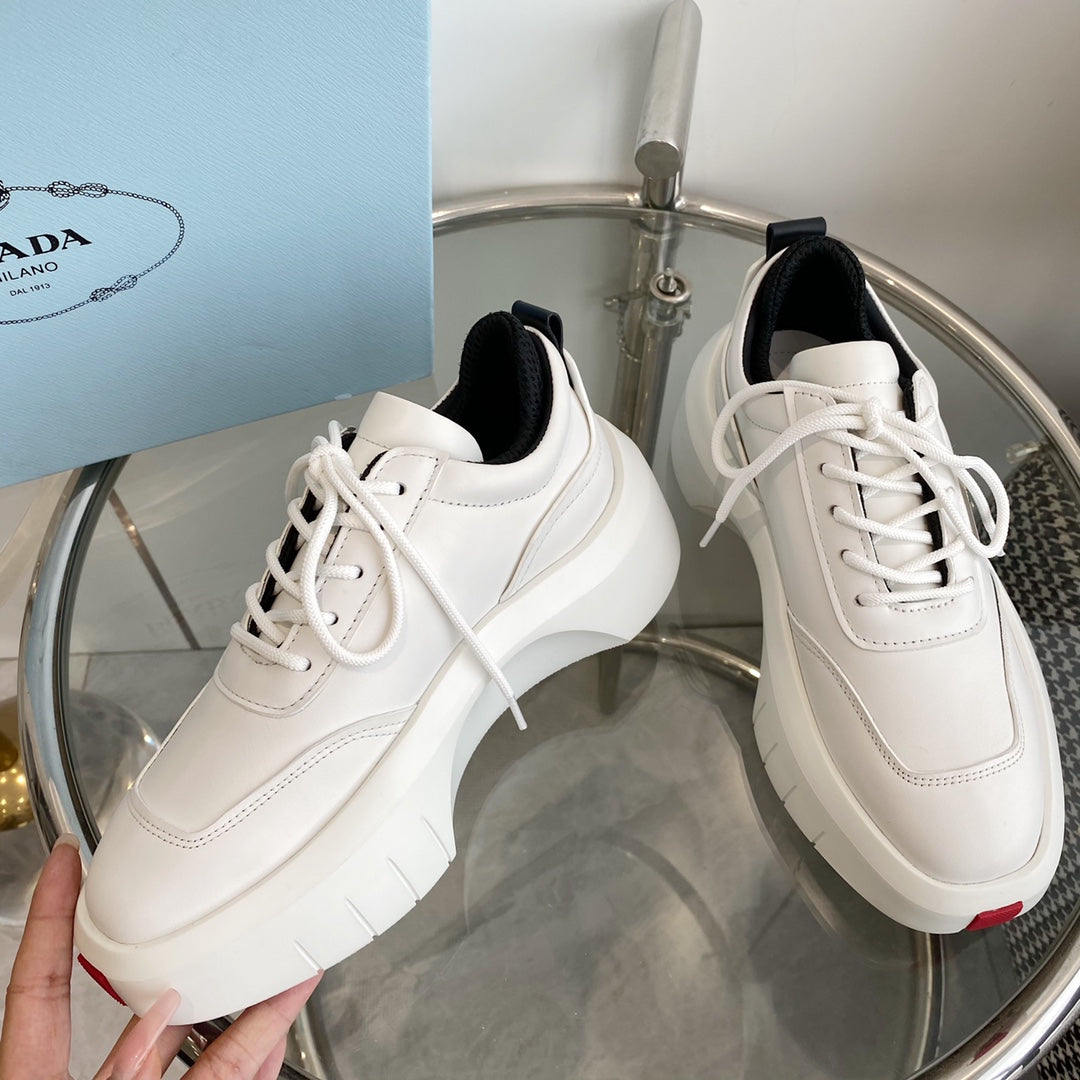 PRADA THICK-SOLE SNEAKERS IN CALFSKIN