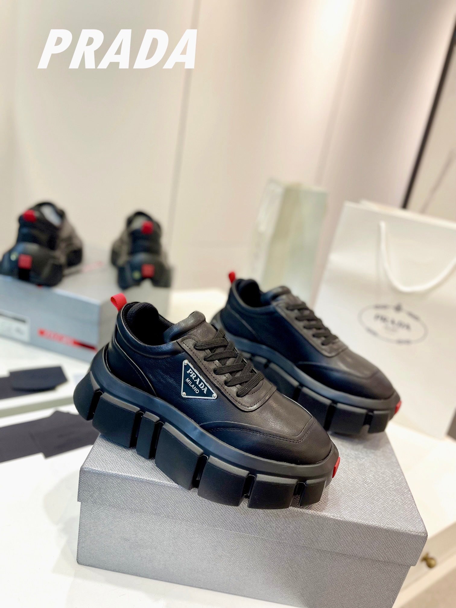 PRADA BRUSHED THICK-SOLE SNEAKERS BLACK CALFSKIN