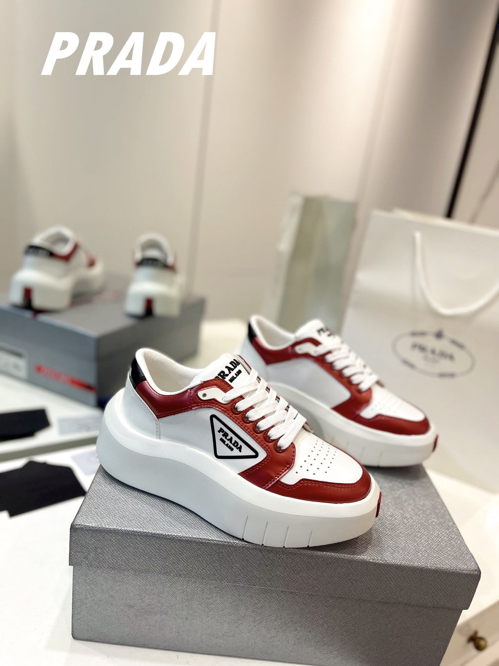PRADA DOWNTOWN THICK-SOLE SNEAKERS WHITE AND CHERRY CALFSKIN