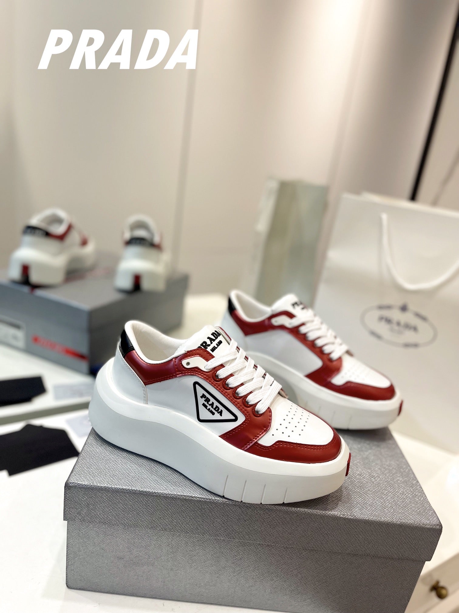 PRADA DOWNTOWN THICK-SOLE SNEAKERS WHITE AND CHERRY CALFSKIN