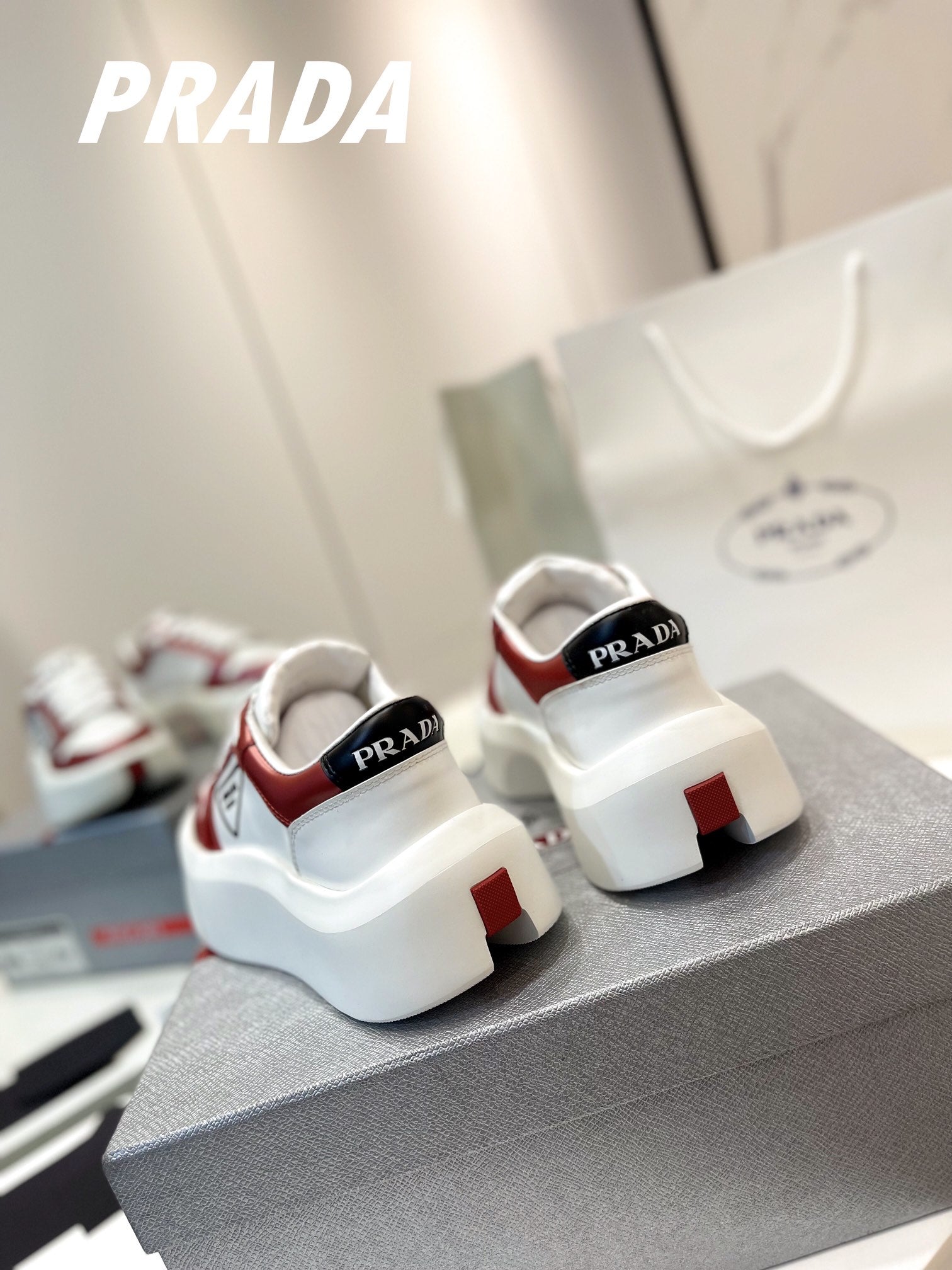 PRADA DOWNTOWN THICK-SOLE SNEAKERS WHITE AND CHERRY CALFSKIN
