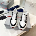 PRADA DOWNTOWN THICK-SOLE SNEAKERS BLACK AND WHITE CALFSKIN