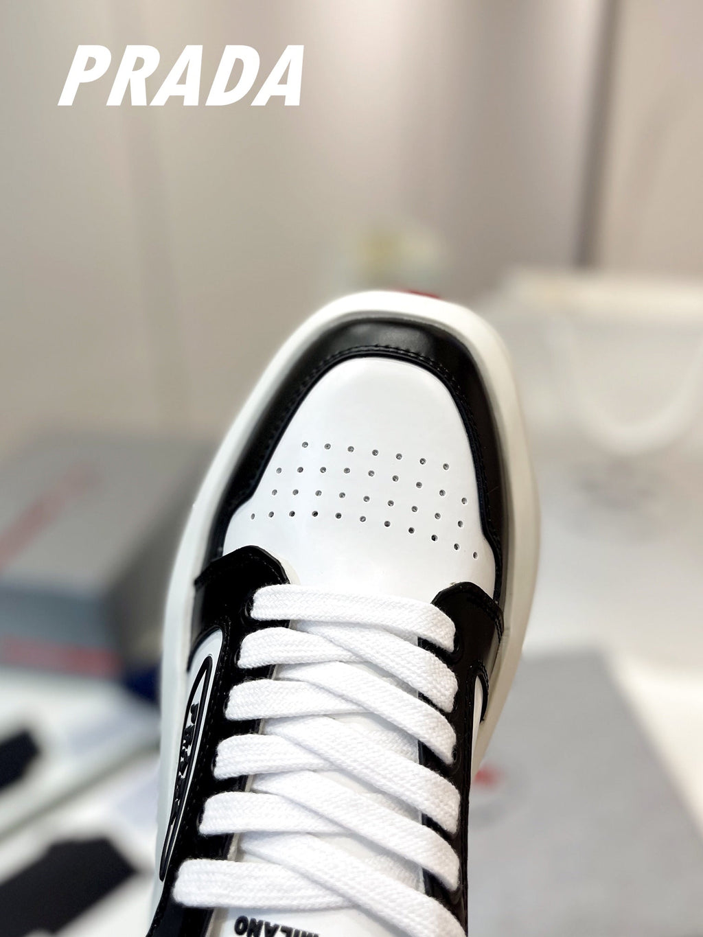 PRADA DOWNTOWN THICK-SOLE SNEAKERS BLACK AND WHITE CALFSKIN