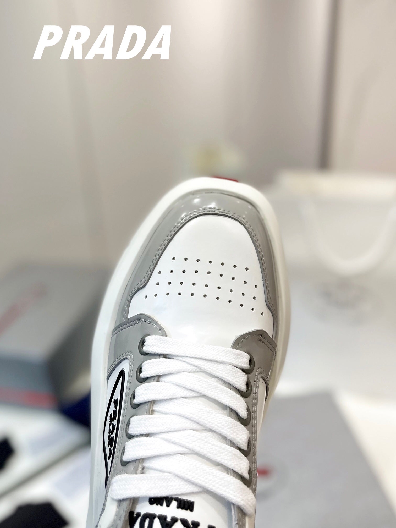 PRADA DOWNTOWN THICK-SOLE SNEAKERS WHITE AND GRAY CALFSKIN